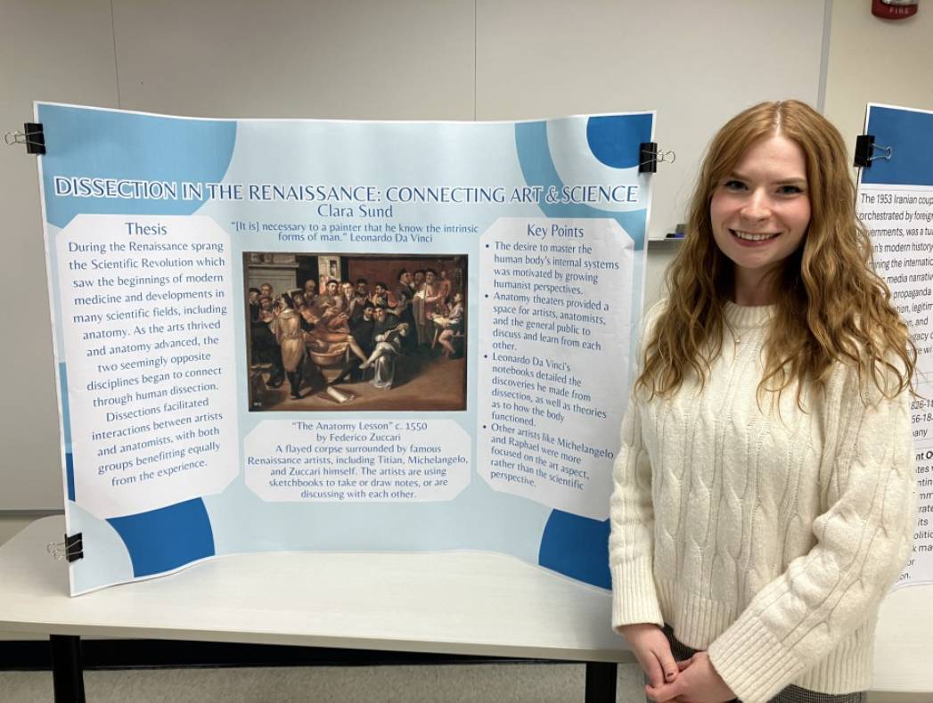 Clara Sund Standing by her Presentation